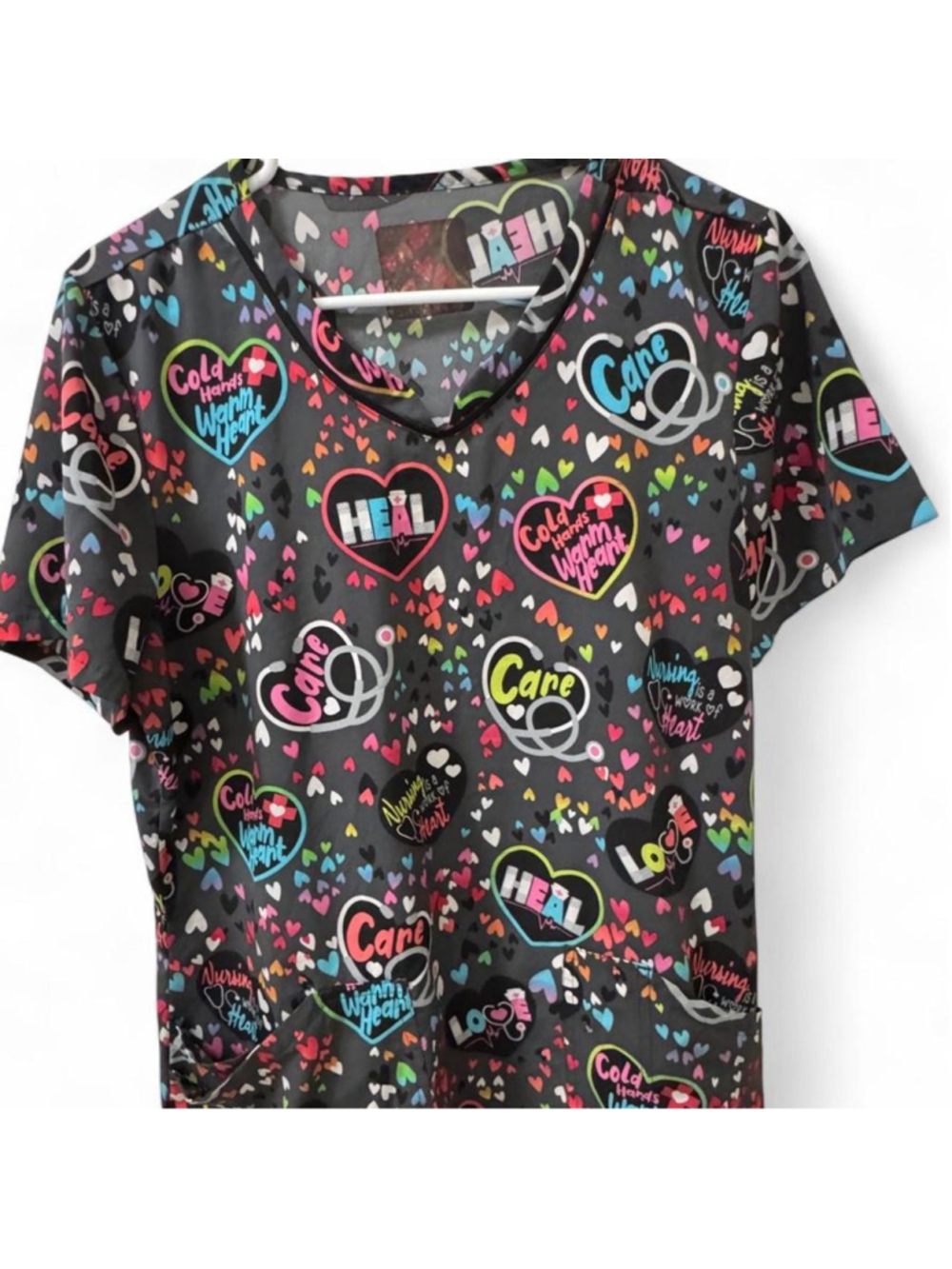 Black Size Medium scrub top with multicolored hearts and words like 'HEAL', 'CAR